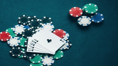 Royal Flush on top of chips on a green felt table