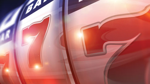 red, white and blue color close up of slot machine 777