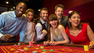 Guests cheer as the roulette wheel spins.