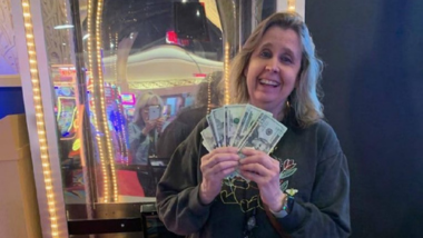 Real Cash Cash Cube Winner posting with her fan of cash